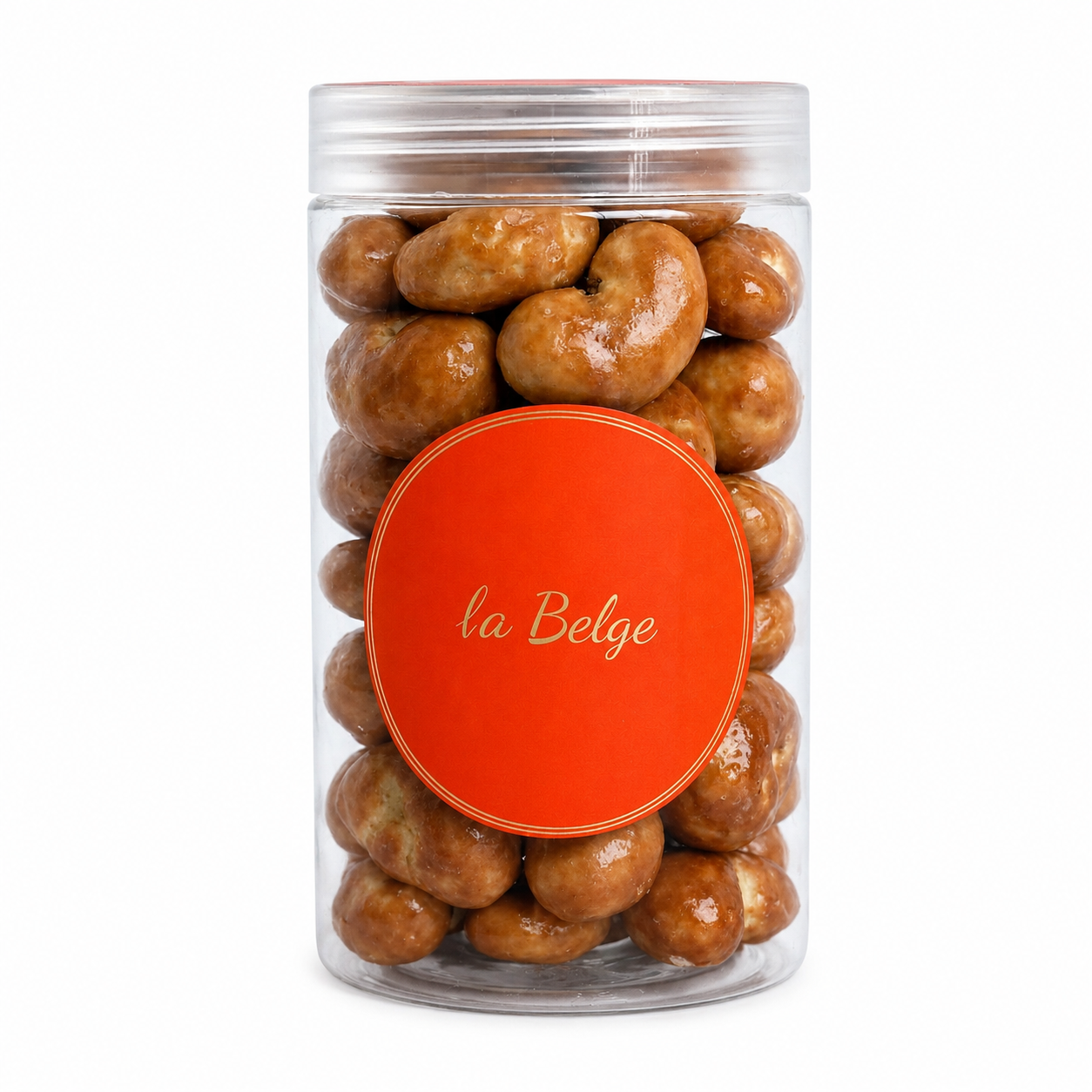 La Belge Caramel Cashew in a premium clear cylinder filled with whole cashews coated in smooth caramel and fine Belgian chocolate.