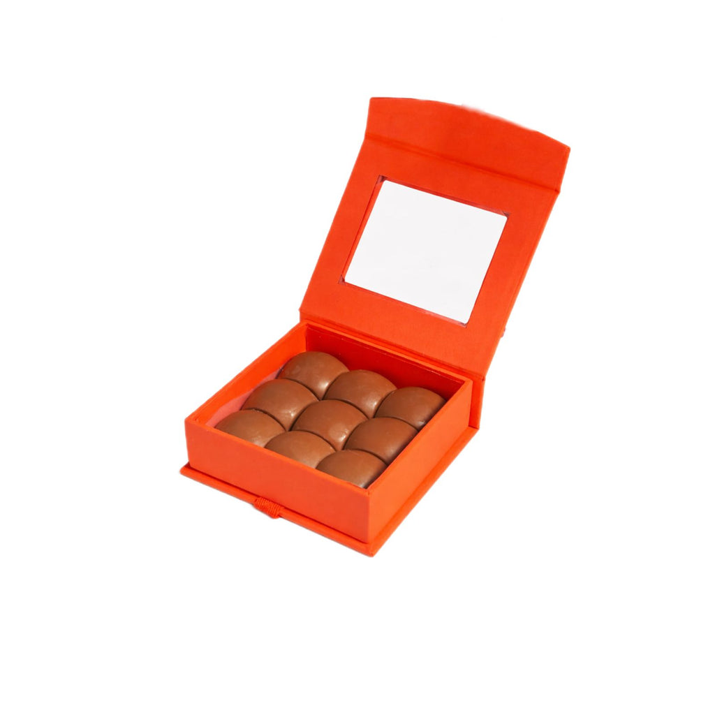 La Belge Belgian chocolate box filled with pistachio chocolates, luxury orange gift box open
