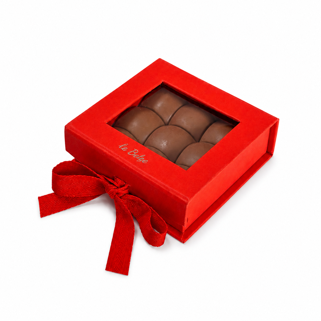 Closed luxury box of pistachio praline chocolate domes La Belge